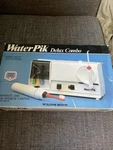 Vintage Teledyne Waterpik Delux Model 400-W Open Box. Fixed Price $120.00.