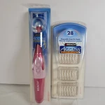 Lot Vintage Reach Access Power Flosser & 28 Disposable Heads. Fixed Price $105.99.