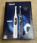 Oral-b Io Series 7 Electric Toothbrush, Sapphire Blue & White Alabaster, 2 Pack. Fixed Price $215.00.