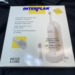 Brand New Bausch & Lomb Interplak Plus Electric Toothbrush 2 Heads. Fixed Price $45.00.
