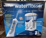 Waterpik Waterflosser Ultra & Cordless Plus + Tips New Sealed. Fixed Price $74.95.