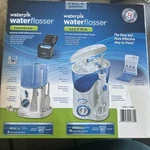Waterpik Waterflosser Ultra And Traveler # 778082 New Sealed. Fixed Price $49.00.