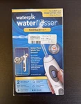 Waterpik Flosser Showerpik WP-480W While You Open Box. Fixed Price $65.00.