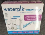 Waterpik Ultra Plus And Cordless Pearl Flosser Combo Pack - New , P2. Fixed Price $62.99.