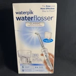 Waterpik Flosser Classic Professional (6 Settings 3 Tips) New, Sealed Box. Fixed Price $99.00.