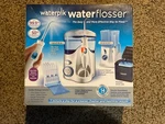 New In Box. Waterpik Waterflosser Ultra And Traveler Flosser. 978082.. Fixed Price $50.00.