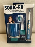 Sonic-fx Toothbrush With Uv Sanitizer, 4 Heads, Blue New. Fixed Price $35.00.