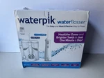 Waterpik Ultra Plus And Cordless Pearl Flosser Combo Pack - New Unused. Fixed Price $58.99.