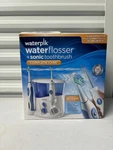 Waterpik Flosser+ Sonic Toothbrush Complete Care & Charging Station WP-900. Fixed Price $58.99.