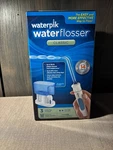 Waterpik Flosser Classic, Pressure Settings (model: WP-65W). Fixed Price $35.00.