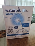 Boxed Waterpik Flosser Platinum (WP-100W Plt). Fixed Price $57.00.