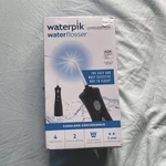 Waterpik Cordless Plus Flosser WF-03 Black, Rechargeable, 2 Settings. Fixed Price $55.00.