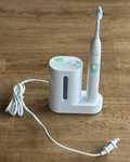 Philips HX681A Sonicare Electric Toothbrush 2 Heads & Charging Base/uv Cleaner. Fixed Price $15.00.