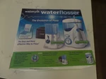 New Waterpik Model# WP-100W /WP-305W White Ultra Flosser. Fixed Price $79.99.