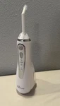 Waterpik Waterflosser/ear Irrigation Tool, Parts Only, Used, No Charging Cord. Fixed Price $15.99.