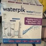 Waterpik Ultra Plus & Cordless Pearl Flosser Set W/ Tips Travel Bag. Fixed Price $20.00.