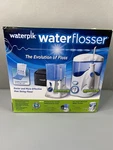 Waterpik Waterflosser Ultra And Traveler #778082 New Sealed. Fixed Price $65.00.